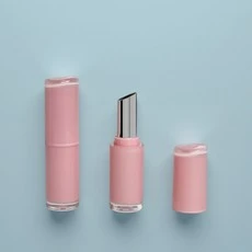 Empty pink lipstick tube